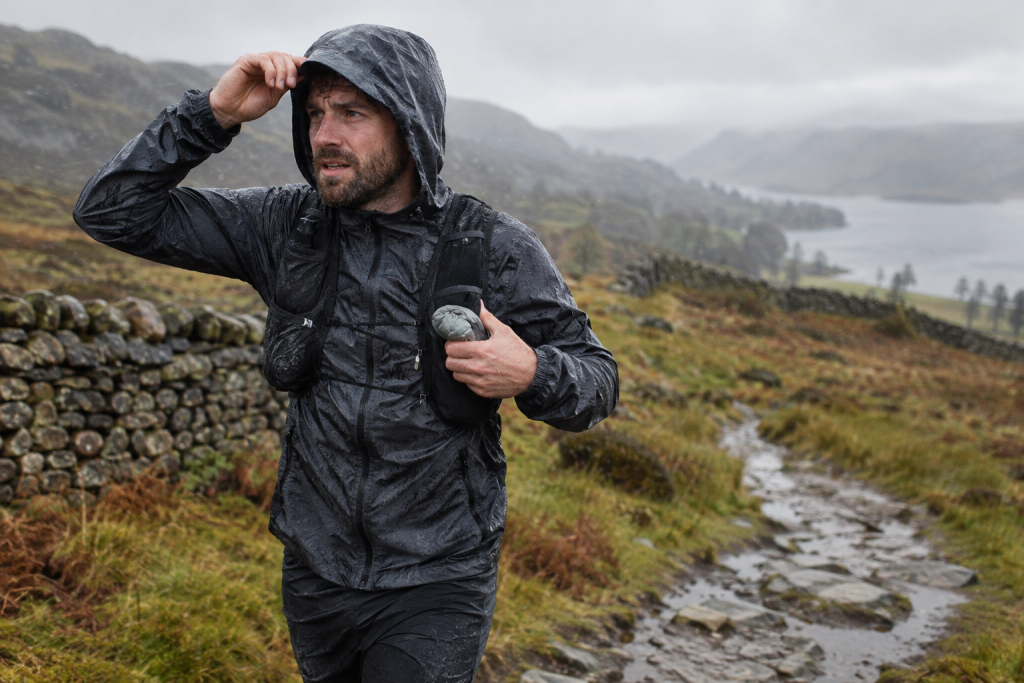 Runner wearing a waterproof jacket in rain